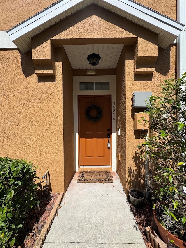 7544 Red Mill Cir, New Port Richey, FL 34653 - property entrance with stucco siding