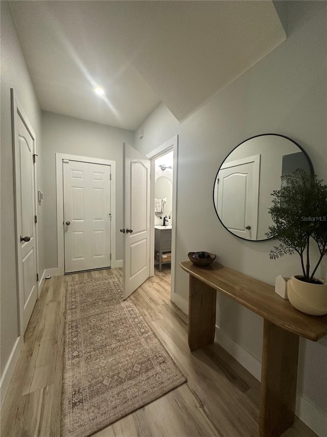 7544 Red Mill Cir, New Port Richey, FL 34653 - entryway with light wood-type flooring and baseboards