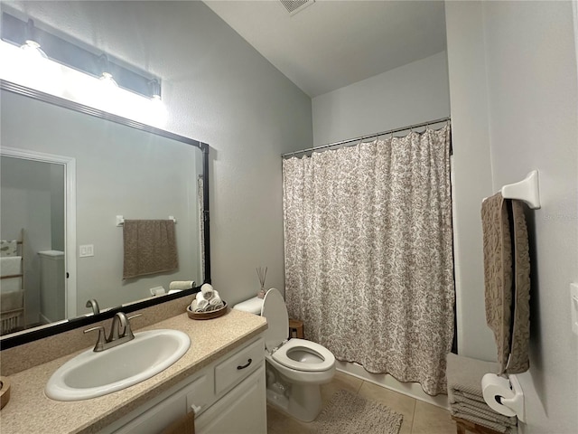7544 Red Mill Cir, New Port Richey, FL 34653 - full bathroom with toilet, vanity, and tile patterned flooring