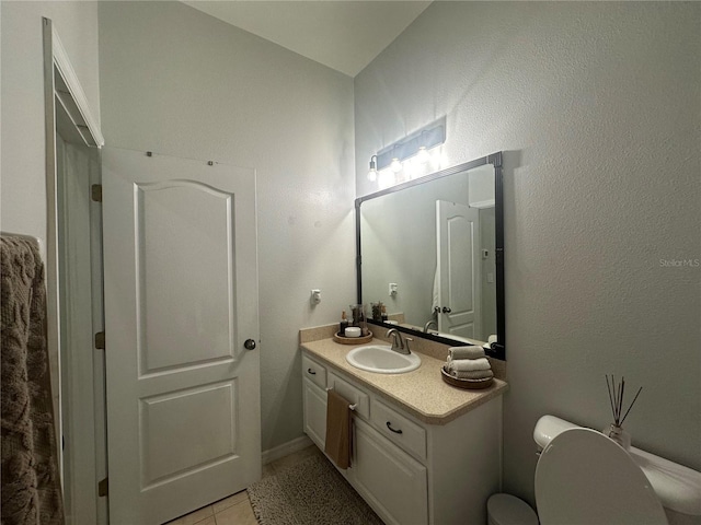 7544 Red Mill Cir, New Port Richey, FL 34653 - bathroom with vanity, toilet, and tile patterned floors