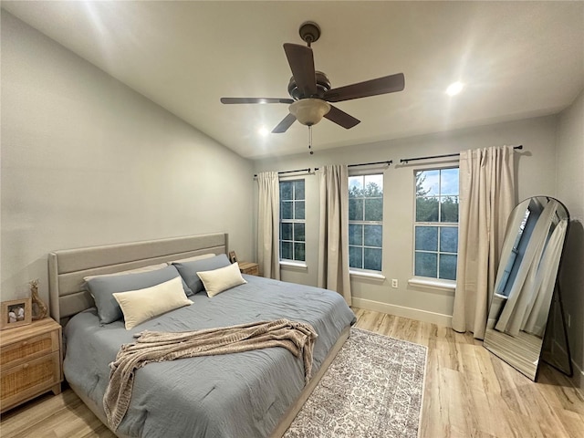7544 Red Mill Cir, New Port Richey, FL 34653 - bedroom with light wood-style flooring, baseboards, and a ceiling fan