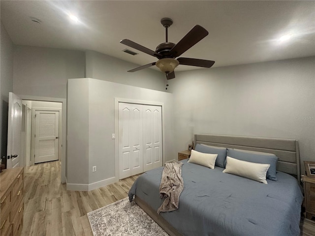 7544 Red Mill Cir, New Port Richey, FL 34653 - bedroom with light wood-style flooring, a closet, a ceiling fan, and baseboards