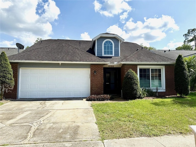 4186 Buglers Rest Pl, Casselberry, FL 32707 - traditional-style house with brick siding, driveway, a front lawn, a garage, and a shingled roof