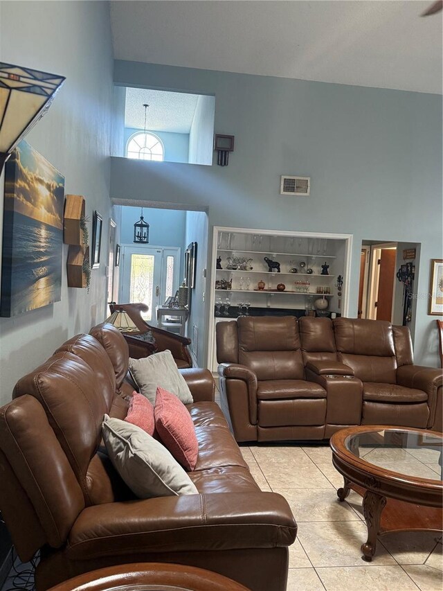 4186 Buglers Rest Pl, Casselberry, FL 32707 - living area with a high ceiling and tile patterned flooring