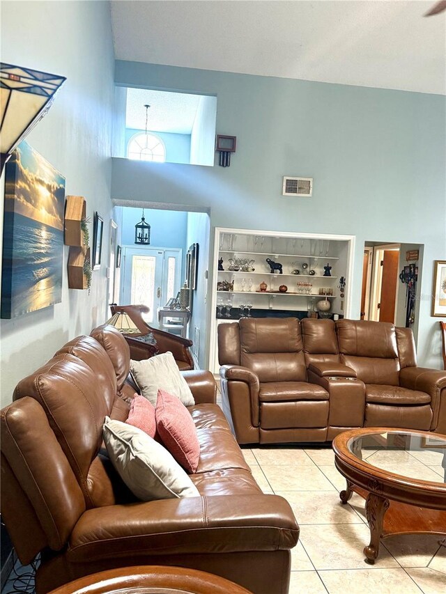 4186 Buglers Rest Pl, Casselberry, FL 32707 - living area featuring a towering ceiling and tile patterned floors