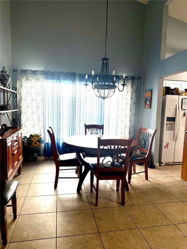 4186 Buglers Rest Pl, Casselberry, FL 32707 - dining room featuring a chandelier and light tile patterned floors