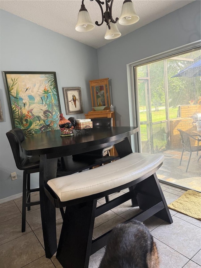 4186 Buglers Rest Pl, Casselberry, FL 32707 - dining space with a textured ceiling, tile patterned flooring, and baseboards