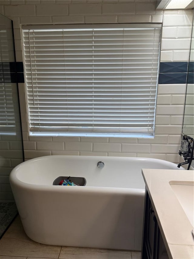 4186 Buglers Rest Pl, Casselberry, FL 32707 - bathroom featuring a freestanding tub, vanity, and tile patterned flooring