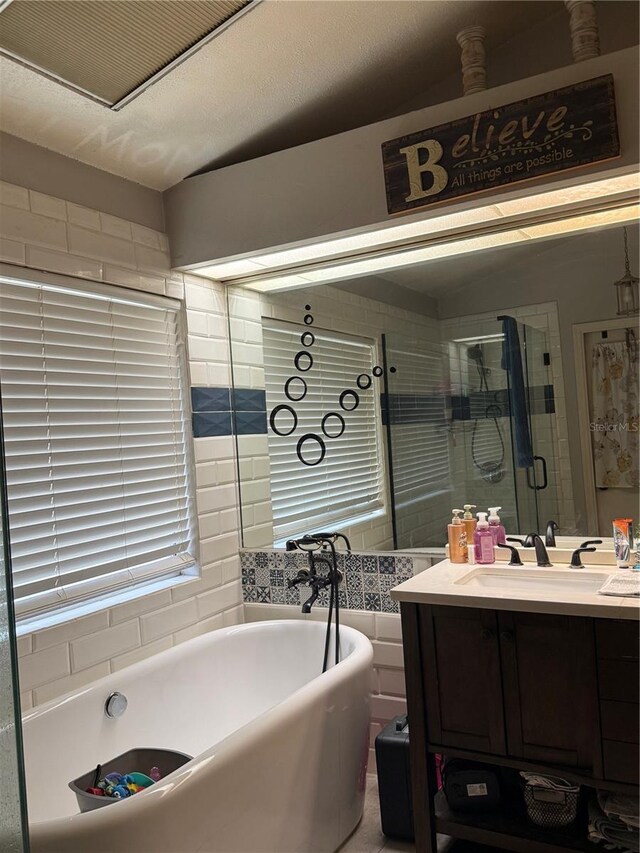 4186 Buglers Rest Pl, Casselberry, FL 32707 - bathroom featuring a soaking tub, vanity, and a shower stall