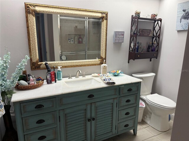 4186 Buglers Rest Pl, Casselberry, FL 32707 - bathroom featuring toilet, vanity, a tile shower, and tile patterned floors