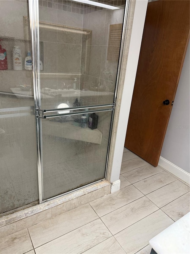 4186 Buglers Rest Pl, Casselberry, FL 32707 - bathroom with a stall shower and baseboards