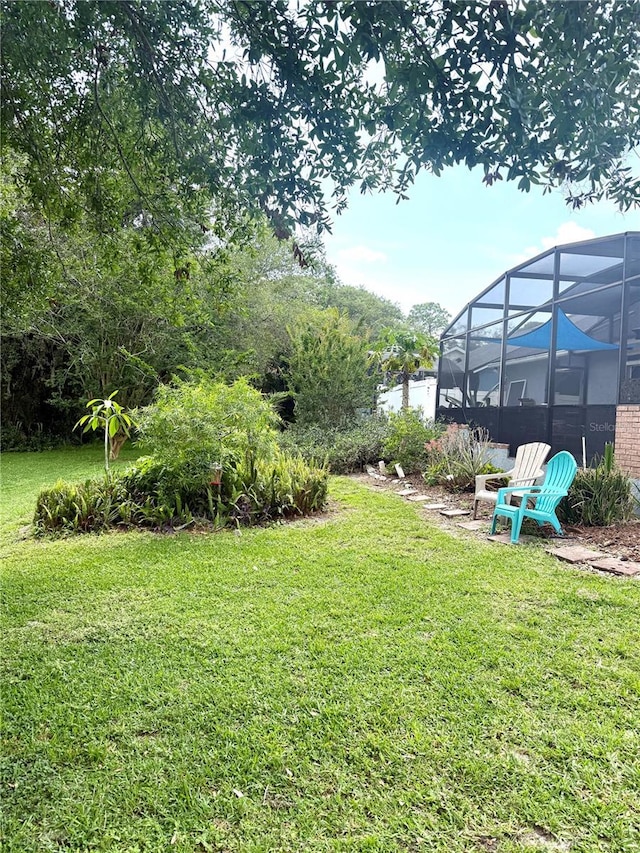 4186 Buglers Rest Pl, Casselberry, FL 32707 - view of grassy yard with glass enclosure