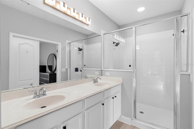 14126 Walcott Ave, Orlando, FL 32827 - bathroom featuring a shower stall, double vanity, and recessed lighting