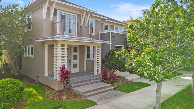 14126 Walcott Ave, Orlando, FL 32827 - townhome / multi-family property with stucco siding and a balcony