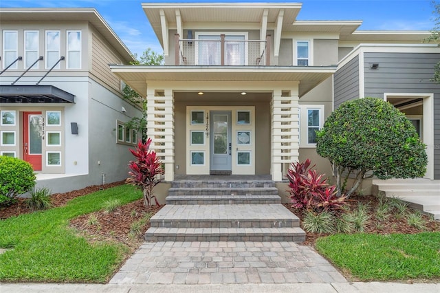 14126 Walcott Ave, Orlando, FL 32827 - entrance to property with a balcony and stucco siding
