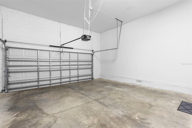14126 Walcott Ave, Orlando, FL 32827 - garage featuring a garage door opener and baseboards