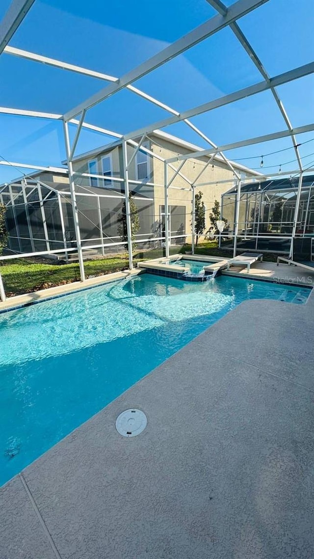 851 Drop Shot Dr, Davenport, FL 33896 - view of pool with a lanai, a patio area, and a pool with connected hot tub