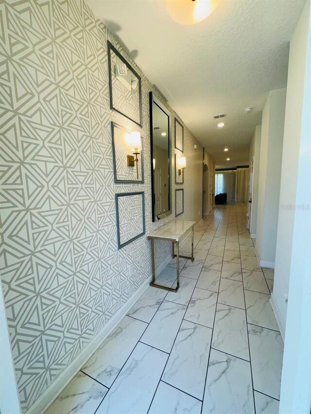 851 Drop Shot Dr, Davenport, FL 33896 - hall with baseboards, light marble finish floors, and a textured ceiling