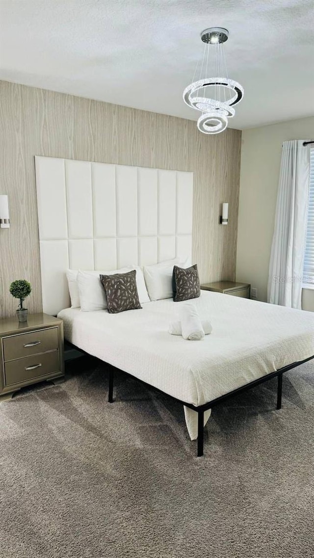851 Drop Shot Dr, Davenport, FL 33896 - bedroom featuring carpet flooring and a chandelier