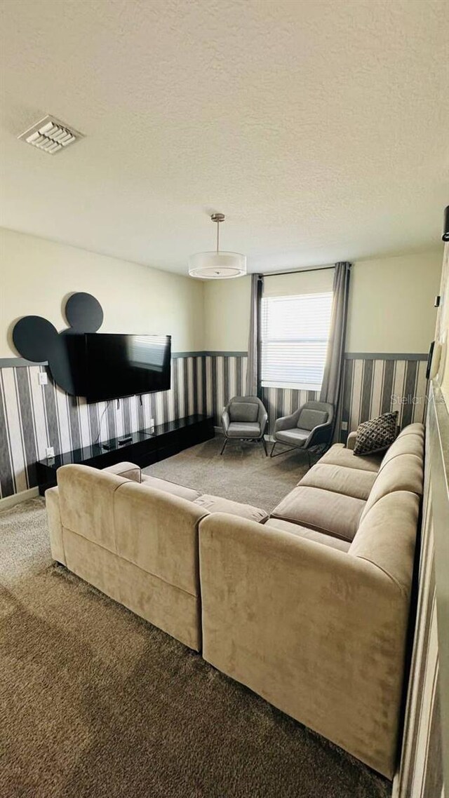 851 Drop Shot Dr, Davenport, FL 33896 - living room featuring carpet floors and a textured ceiling