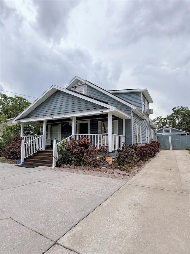 319 N Scenic Hwy, Frostproof, FL 33843 - view of front facade with a porch and driveway