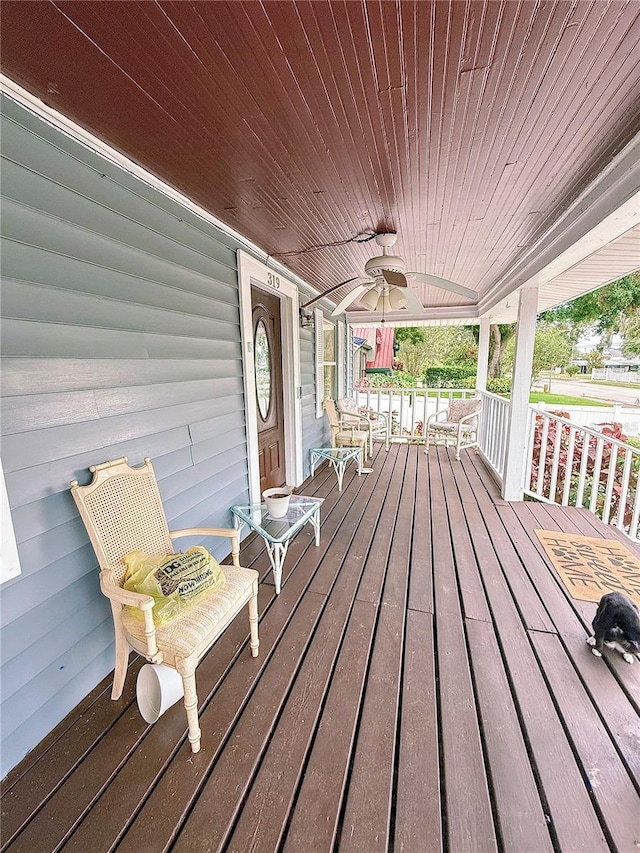 319 N Scenic Hwy, Frostproof, FL 33843 - porch featuring a ceiling fan