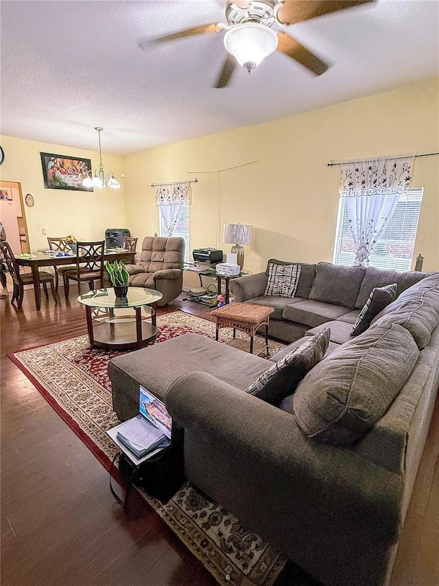 319 N Scenic Hwy, Frostproof, FL 33843 - living room featuring wood finished floors, ceiling fan, and a chandelier