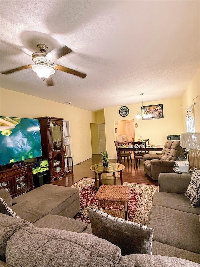 319 N Scenic Hwy, Frostproof, FL 33843 - living area featuring a ceiling fan, a textured ceiling, and wood finished floors