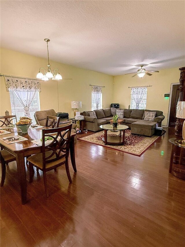 319 N Scenic Hwy, Frostproof, FL 33843 - dining space featuring wood finished floors, a chandelier, a textured ceiling, and ceiling fan