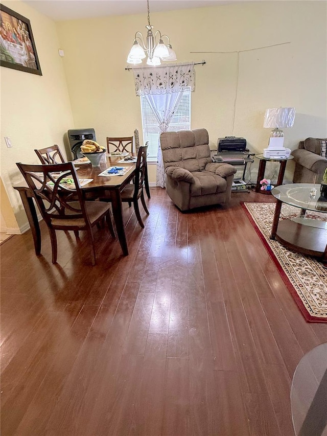 319 N Scenic Hwy, Frostproof, FL 33843 - dining room featuring a chandelier and dark wood-style flooring