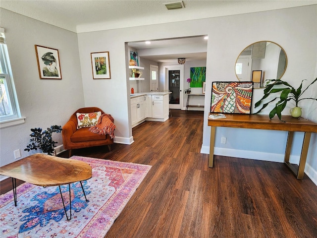 420 61st Ave S, Saint Petersburg, FL 33705 - sitting room featuring dark wood-style floors and baseboards