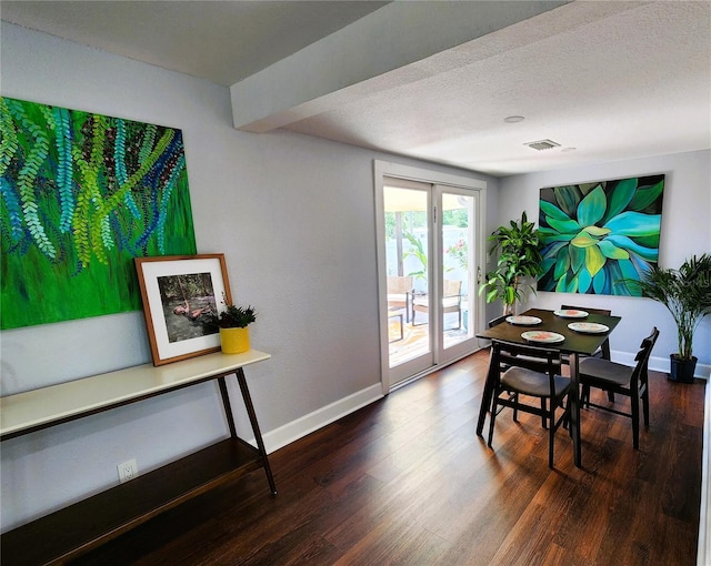 420 61st Ave S, Saint Petersburg, FL 33705 - dining space featuring baseboards and dark wood-style floors