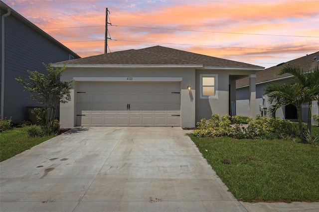 4122 Sagefield Dr, Saint Cloud, FL 34773 - view of front facade featuring stucco siding, a garage, concrete driveway, and a shingled roof