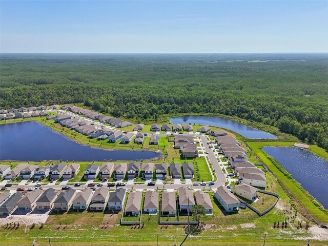 4122 Sagefield Dr, Saint Cloud, FL 34773 - aerial perspective of suburban area featuring a heavily wooded area and a nearby body of water