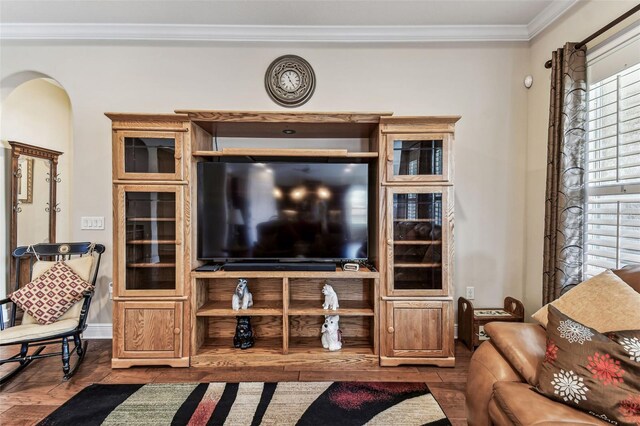 4133 Foxhound Dr, Clermont, FL 34711 - living room featuring crown molding, wood finished floors, and arched walkways