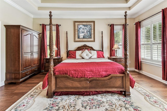 4133 Foxhound Dr, Clermont, FL 34711 - bedroom featuring a raised ceiling, dark wood finished floors, and crown molding