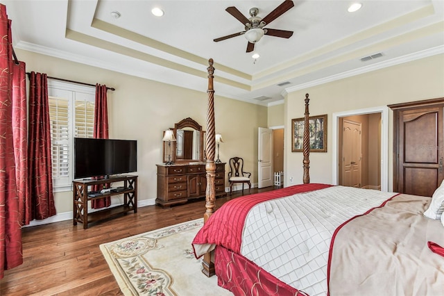 4133 Foxhound Dr, Clermont, FL 34711 - bedroom featuring a raised ceiling, wood finished floors, crown molding, recessed lighting, and ceiling fan