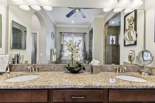 4133 Foxhound Dr, Clermont, FL 34711 - bathroom with crown molding, double vanity, ceiling fan, and tiled shower