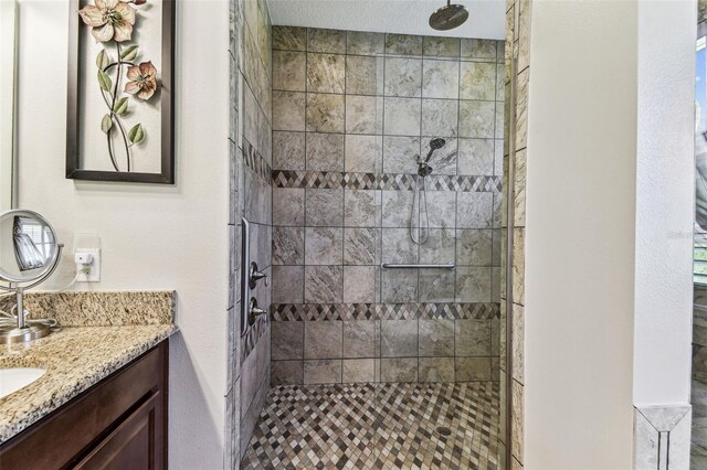 4133 Foxhound Dr, Clermont, FL 34711 - bathroom with vanity and tiled shower