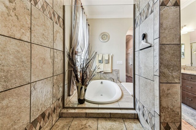 4133 Foxhound Dr, Clermont, FL 34711 - full bathroom featuring vanity, a garden tub, and ornamental molding