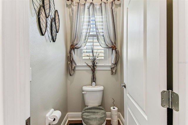 4133 Foxhound Dr, Clermont, FL 34711 - bathroom with toilet and baseboards