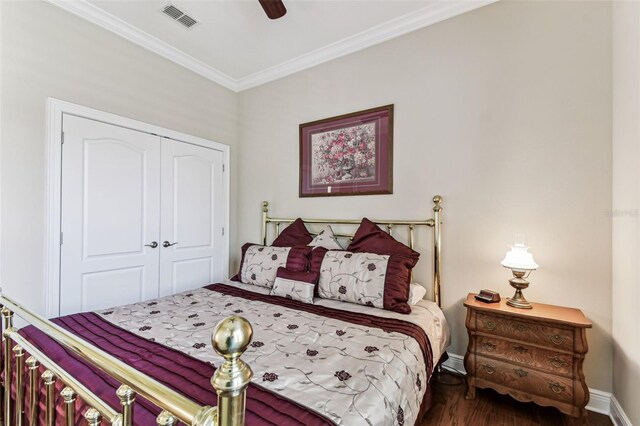 4133 Foxhound Dr, Clermont, FL 34711 - bedroom featuring wood finished floors, a closet, crown molding, and ceiling fan