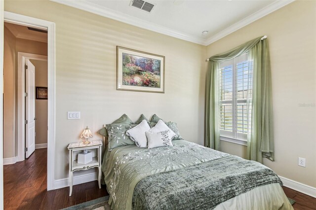 4133 Foxhound Dr, Clermont, FL 34711 - bedroom with crown molding and wood finished floors