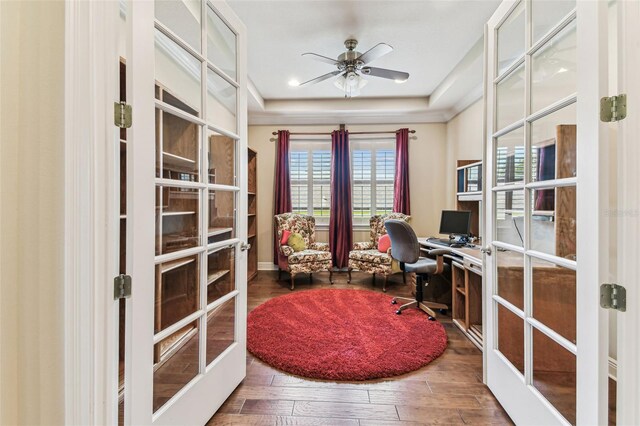 4133 Foxhound Dr, Clermont, FL 34711 - home office featuring a ceiling fan, french doors, wood finished floors, and a tray ceiling