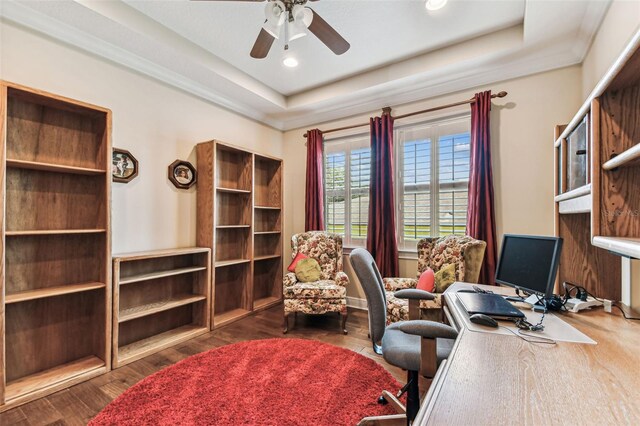 4133 Foxhound Dr, Clermont, FL 34711 - home office featuring a ceiling fan, a tray ceiling, wood finished floors, and recessed lighting