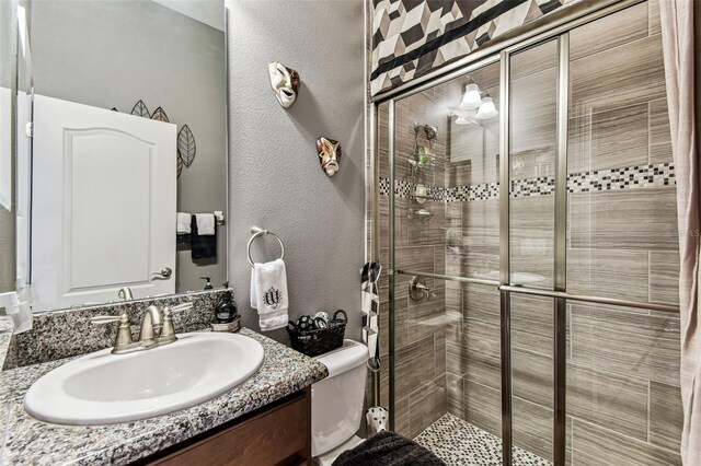 4133 Foxhound Dr, Clermont, FL 34711 - full bathroom with a stall shower, vanity, and a textured wall
