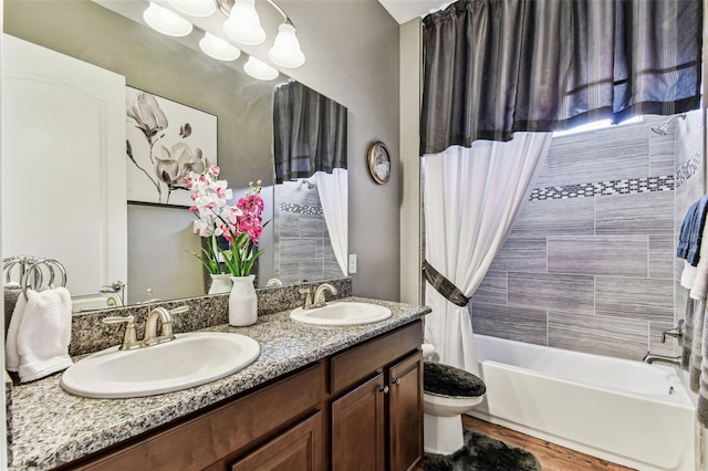 4133 Foxhound Dr, Clermont, FL 34711 - bathroom with double vanity, shower / bathtub combination with curtain, and wood finished floors