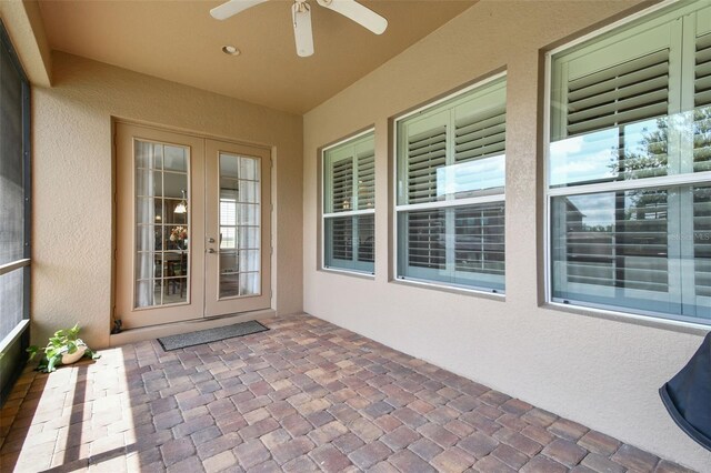 4133 Foxhound Dr, Clermont, FL 34711 - view of exterior entry featuring french doors, stucco siding, ceiling fan, and a patio