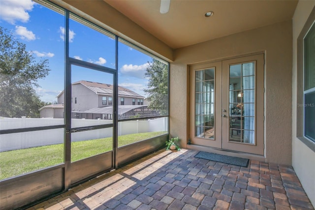 4133 Foxhound Dr, Clermont, FL 34711 - unfurnished sunroom featuring french doors and a residential view