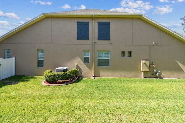 4133 Foxhound Dr, Clermont, FL 34711 - back of house featuring stucco siding